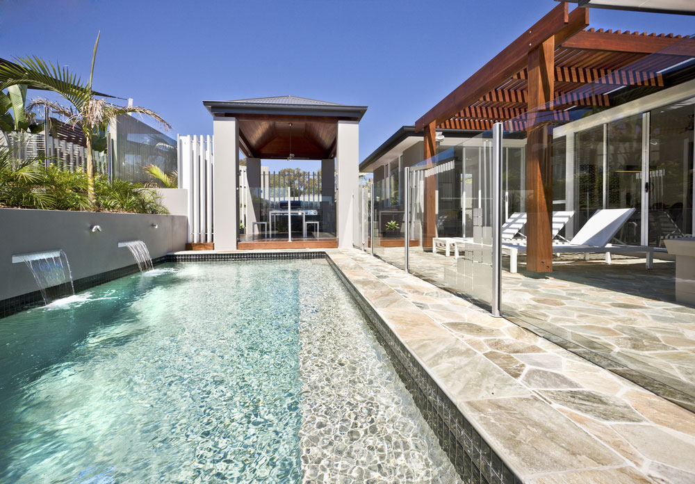 stunning glass railing around patio pool